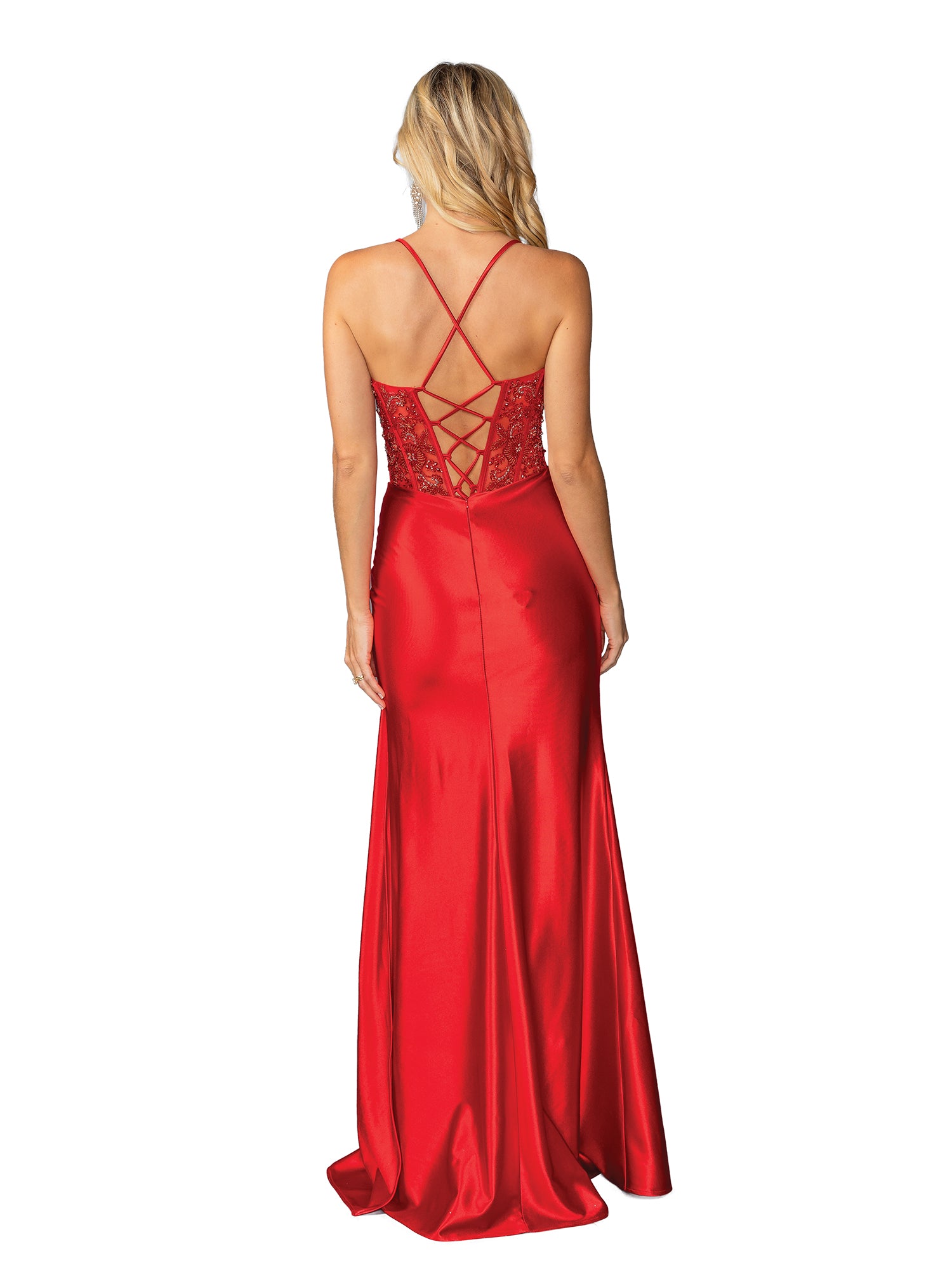 A woman stands with her back to the camera in the Drape-Front Long Prom Dress: Dancing Queen 4439, featuring red satin fabric, a lace-up back, and delicate lace accents.